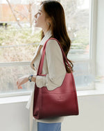 Zmbird Women's Soft Leather Tote Bag woman wearing in red color